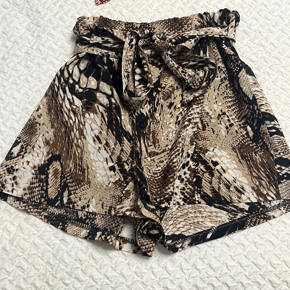 Snake print shorts with snake print belt in a size small